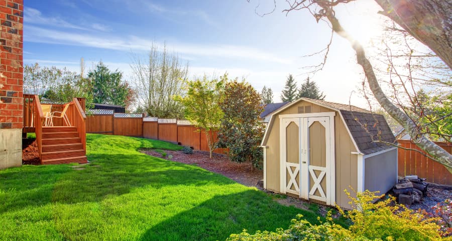 Fenced backyard with storage shed in Dayton